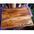 Large chopping board of olive wood with juice groove